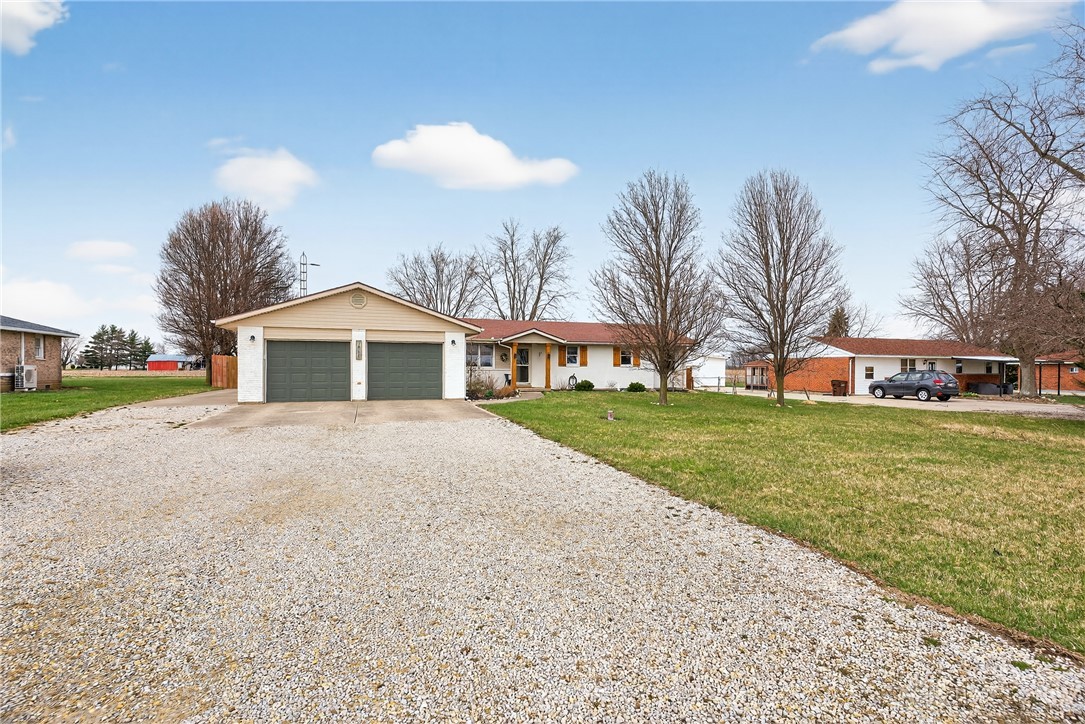 7888 Darke-Preble County Line Road Arcanum, OH 45304 - Photo 3 of 51 This charming home offers ample parking and a spacious yard, creating a welcoming atmosphere.