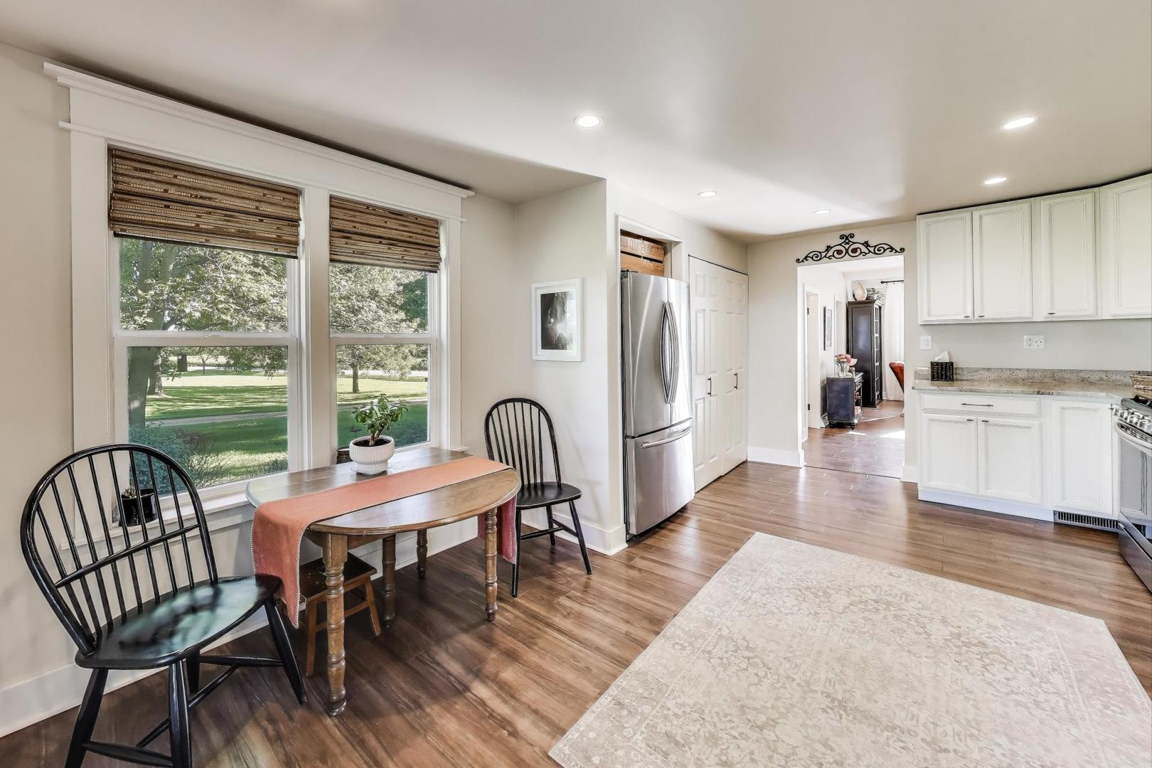 4608 Alden Road Woodstock, IL 60098 - Photo 11 of 42 a view of a dining room with furniture window and wooden floor