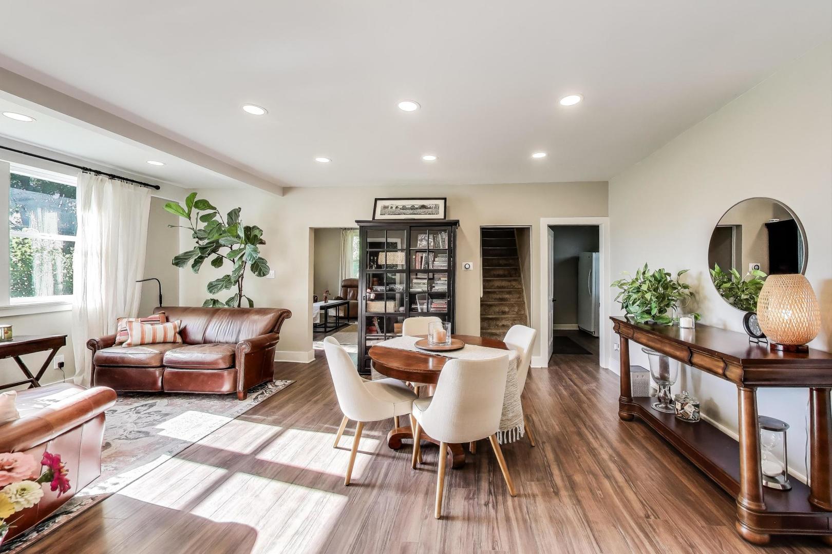 4608 Alden Road Woodstock, IL 60098 - Photo 13 of 42 a living room with furniture a bookshelf and a wooden floor