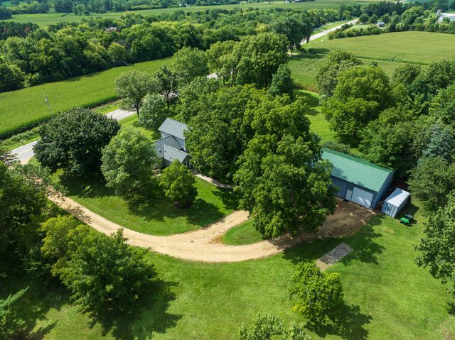 an aerial view of a house with a yard