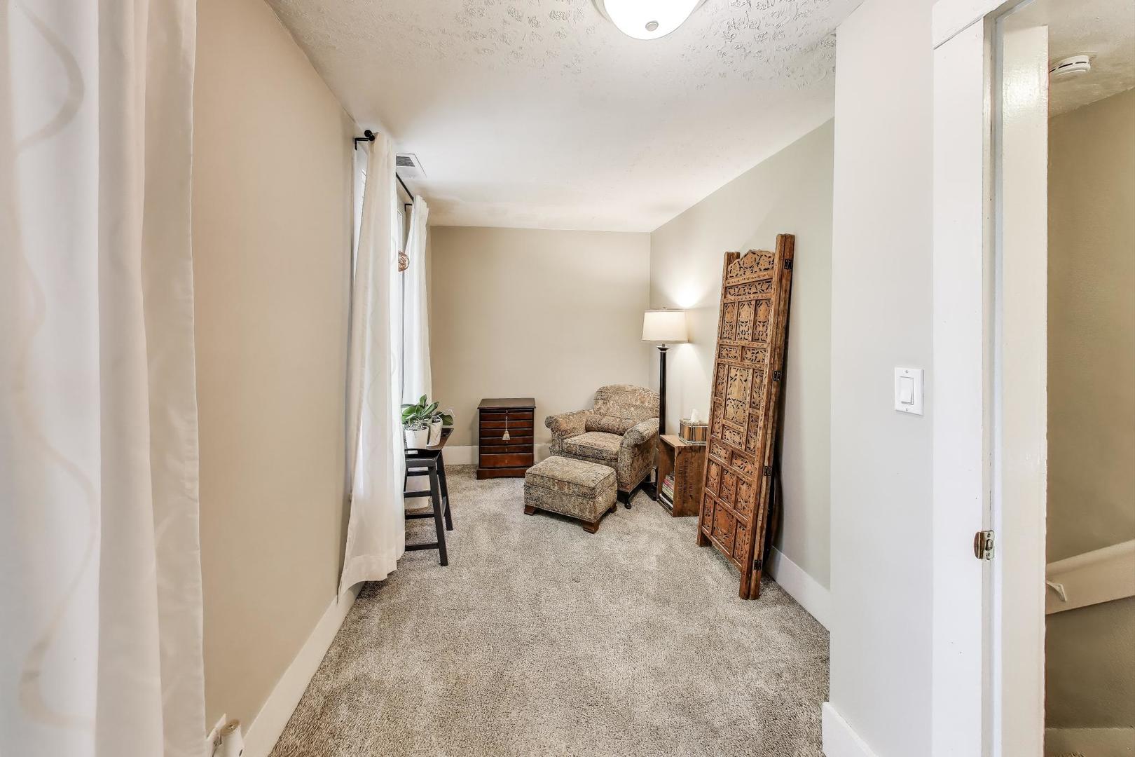 4608 Alden Road Woodstock, IL 60098 - Photo 21 of 42 a view of living room with furniture and a flat screen tv