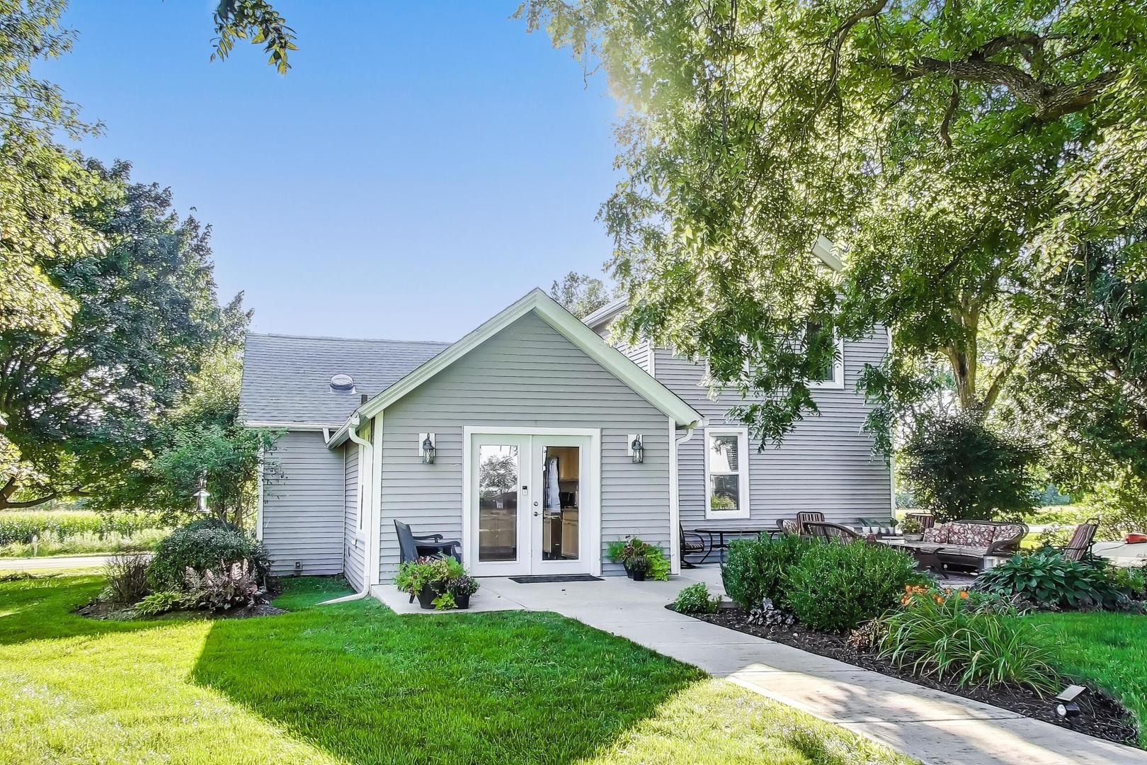 4608 Alden Road Woodstock, IL 60098 - Photo 31 of 42 a front view of a house with a yard and garage