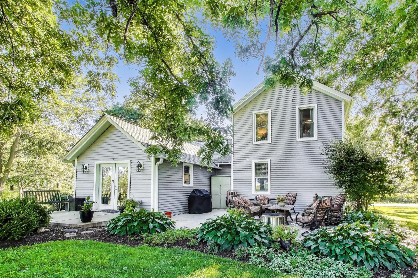 4608 Alden Road Woodstock, IL 60098 - Photo 32 of 42 a front view of a house with garden