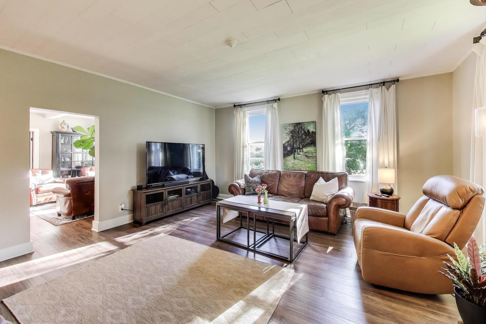 4608 Alden Road Woodstock, IL 60098 - Photo 8 of 42 a living room with furniture and a flat screen tv