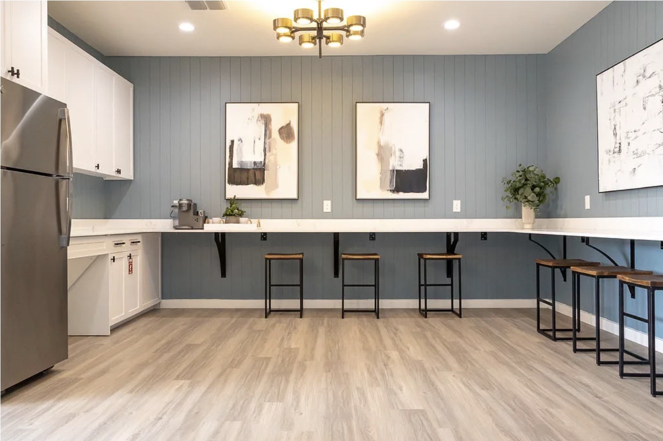 2170 Thousand Oaks Drive, Unit 813T San Antonio, TX 78232 - Photo 14 of 36 a room with stainless steel appliances kitchen island granite countertop a table chairs in it and wooden floors