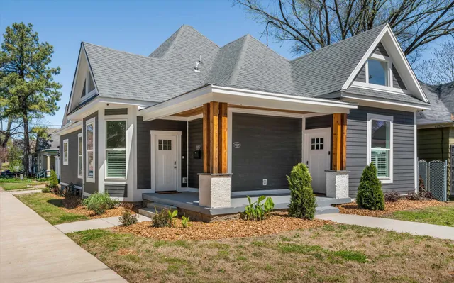 a front view of a house with garden