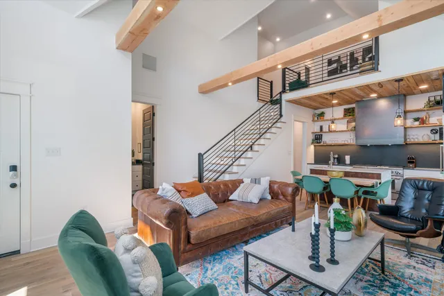 a kitchen that has a sink a stove and a refrigerator