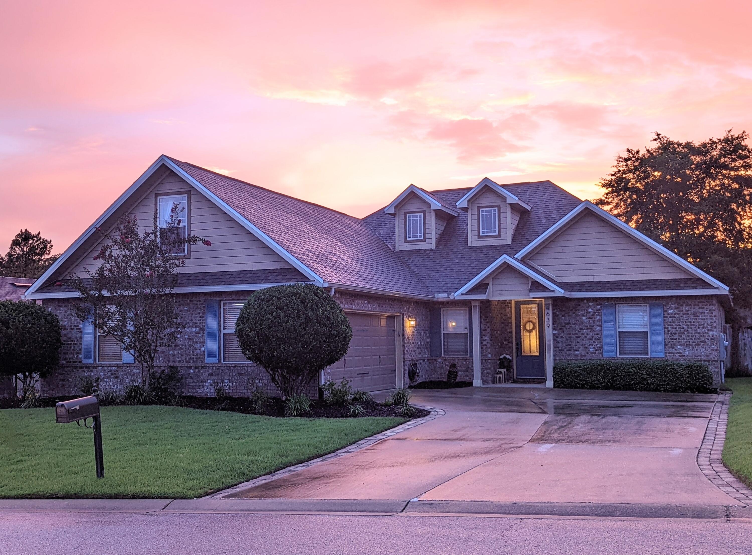 4639 Hermosa Road Crestview, FL 32539 - Photo 1 of 18 a front view of a house with garden