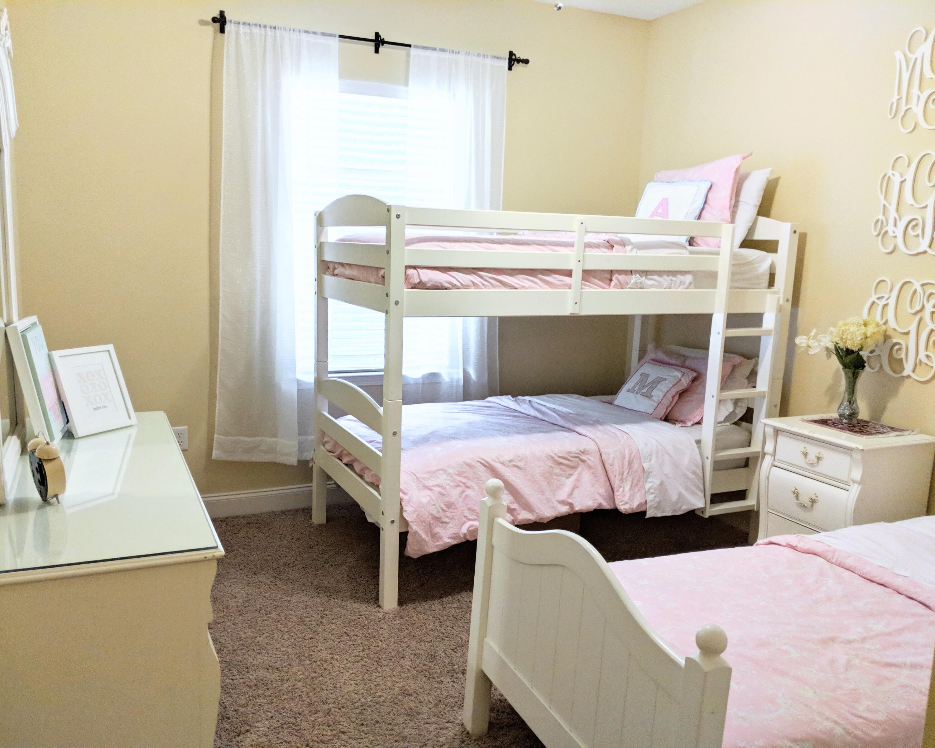 4639 Hermosa Road Crestview, FL 32539 - Photo 11 of 18 a bed room with a bed and a chair