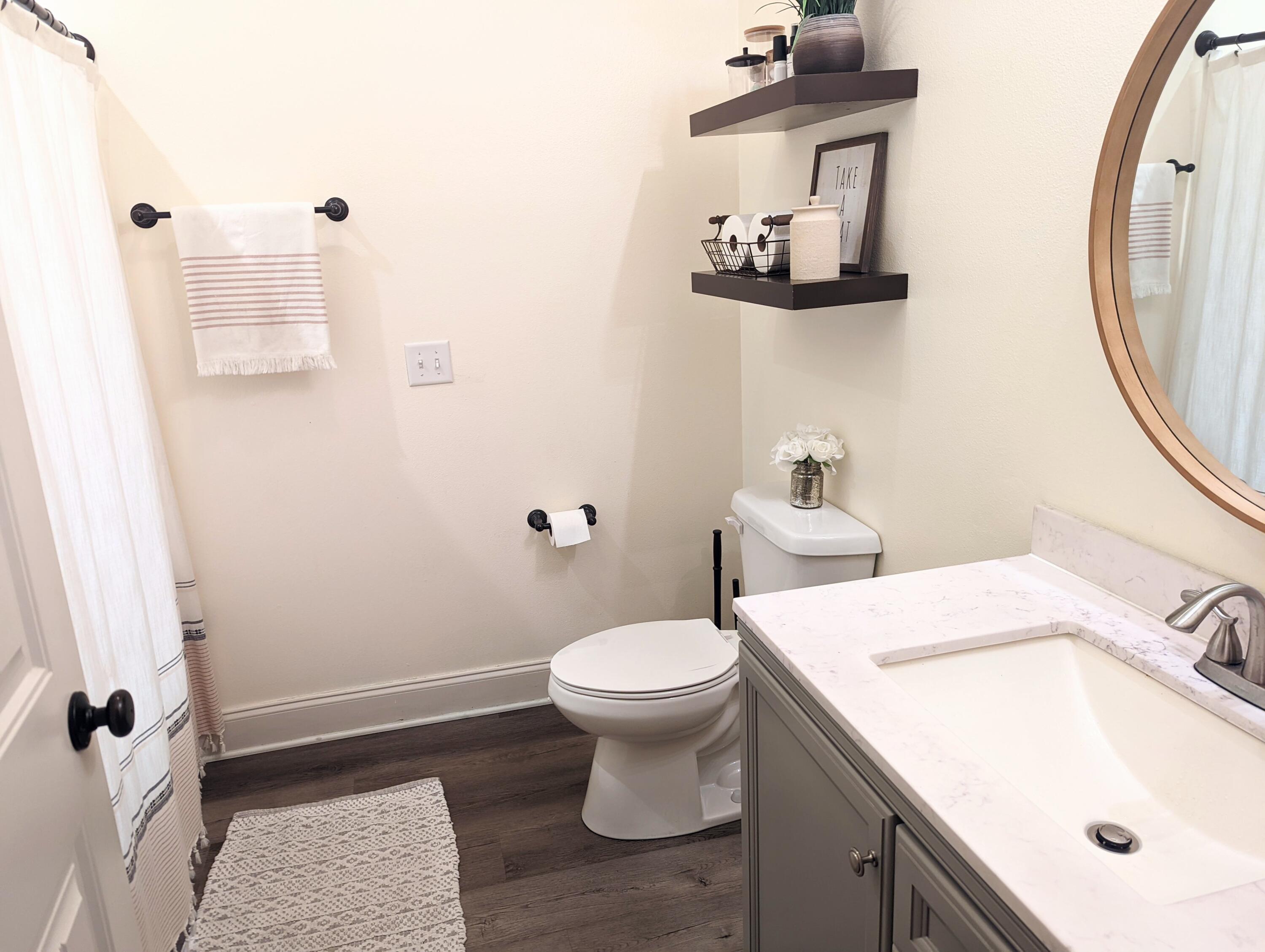 4639 Hermosa Road Crestview, FL 32539 - Photo 12 of 18 a bathroom with a sink toilet and a mirror