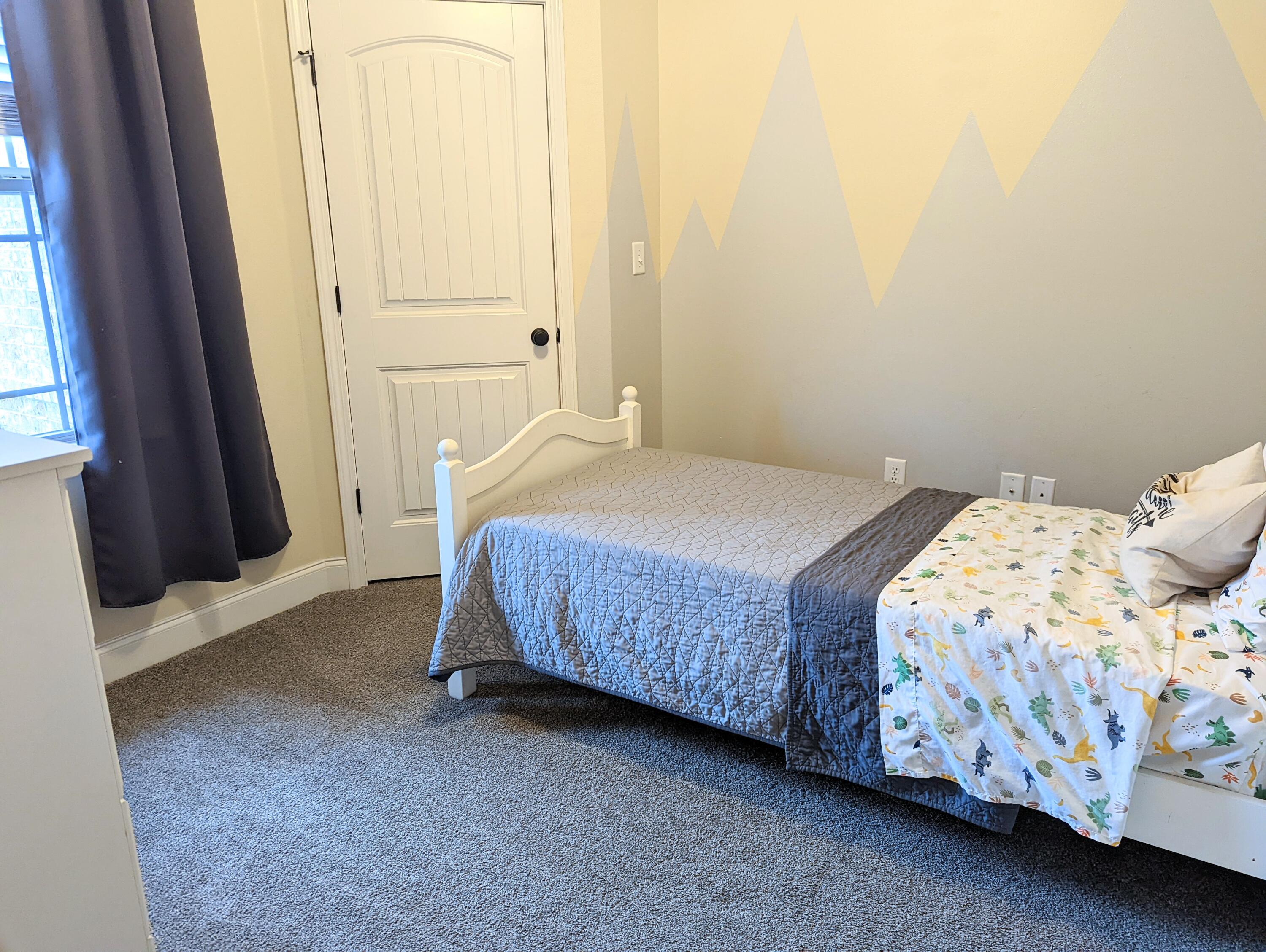 4639 Hermosa Road Crestview, FL 32539 - Photo 13 of 18 a bedroom with a bed and a window