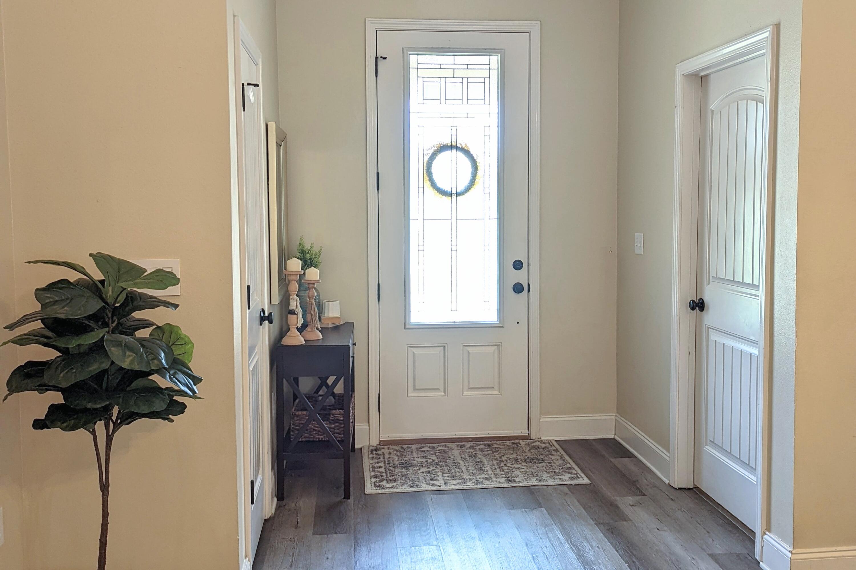 4639 Hermosa Road Crestview, FL 32539 - Photo 2 of 18 a view of entryway with wooden floor