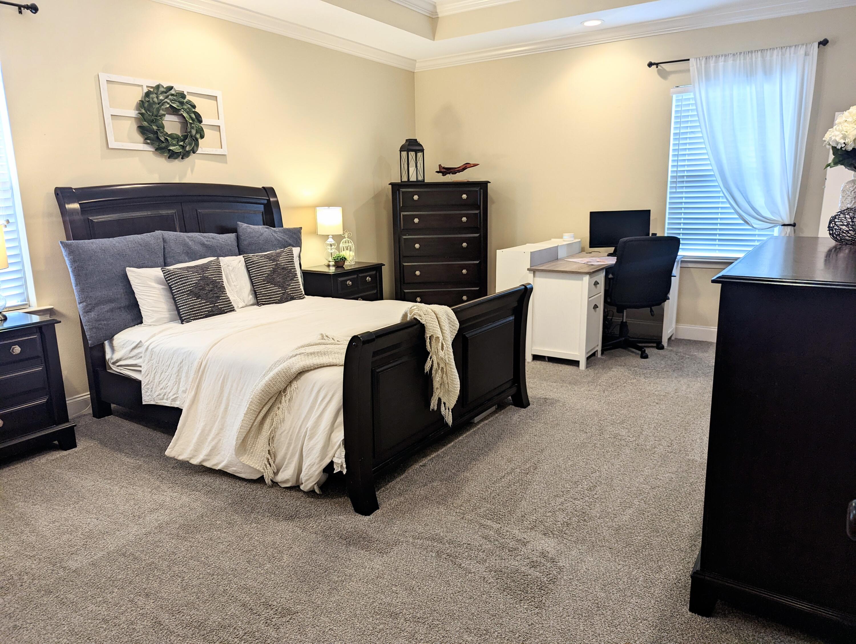 4639 Hermosa Road Crestview, FL 32539 - Photo 7 of 18 a bedroom with a bed and furniture