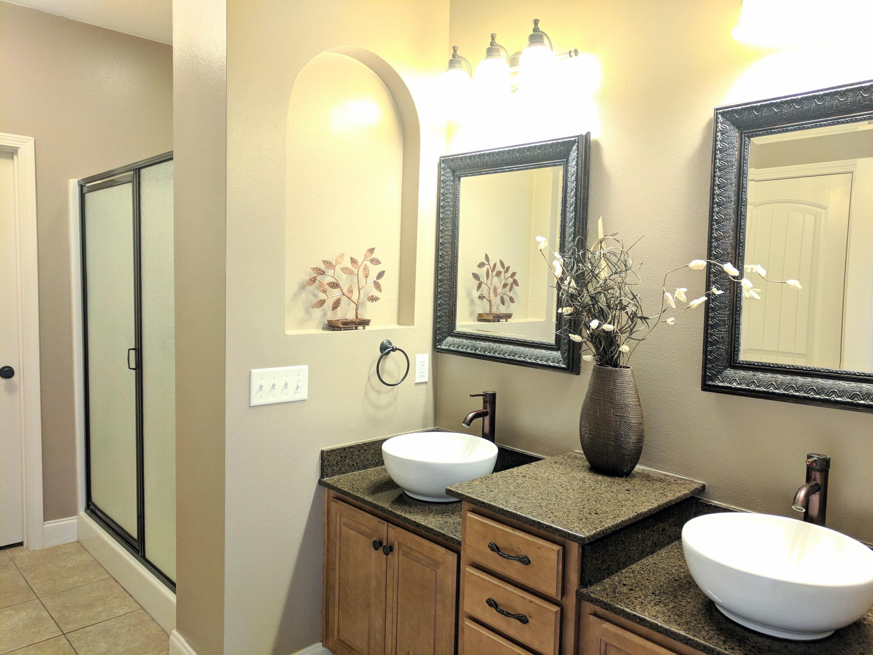 4639 Hermosa Road Crestview, FL 32539 - Photo 8 of 18 a bathroom with a toilet a sink and mirror