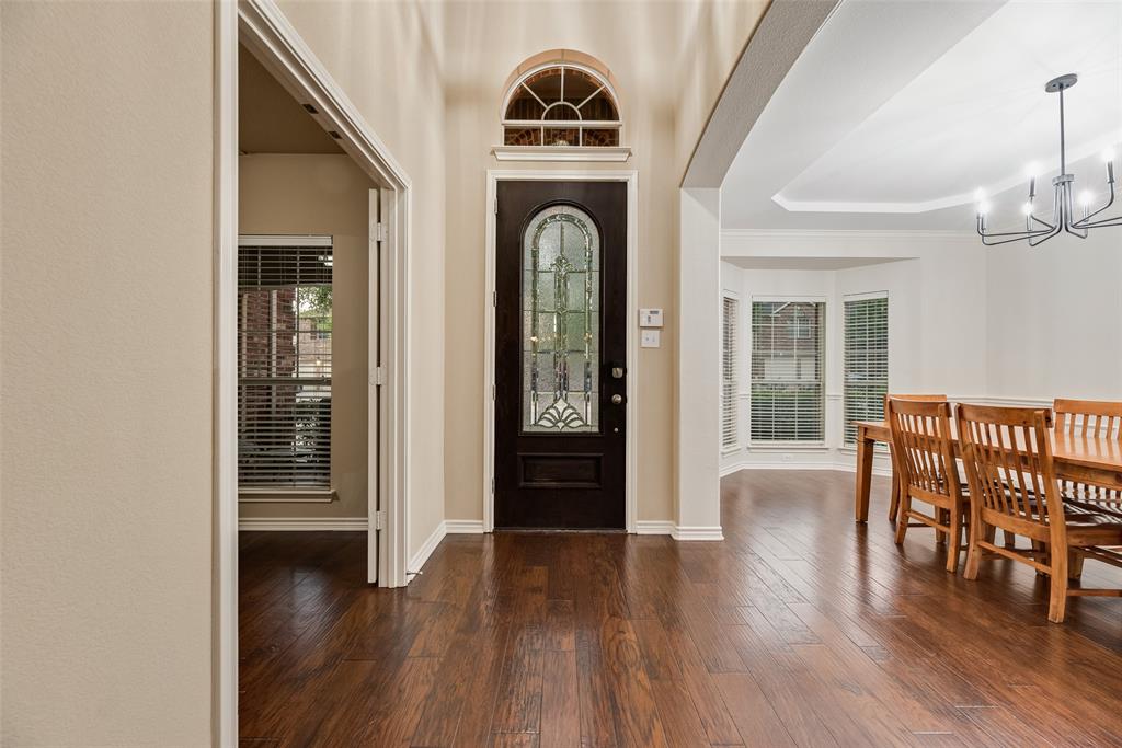 11920 Vienna Apple Road Fort Worth, TX 76244 - Photo 4 of 40 Entryway of 11920 Vienna Apple in Villages of Woodland Springs community in North Fort Worth with hardwood floors, dining room on right and office on left