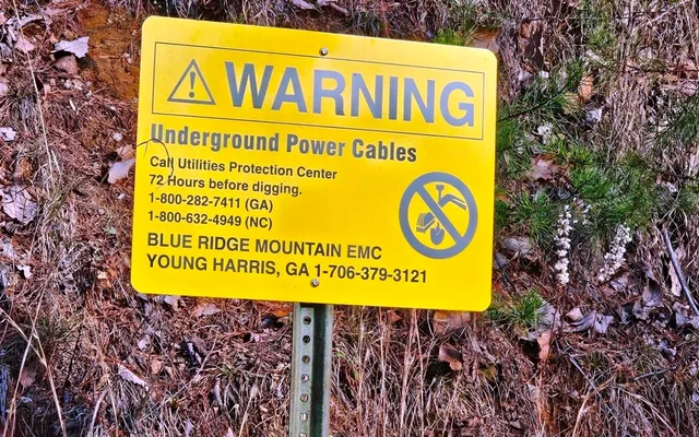 a sign board with a street sign