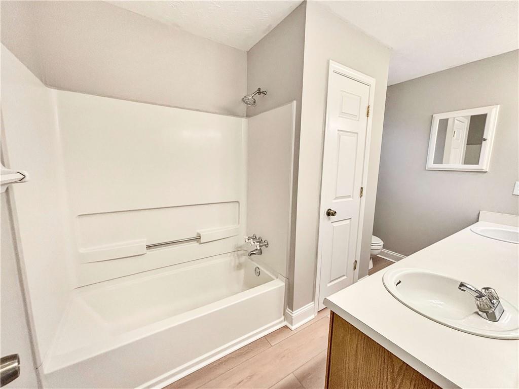 5907 Brookside Drive Southeast Mableton, GA 30126 - Photo 22 of 35 a bathroom with a sink and a bathtub