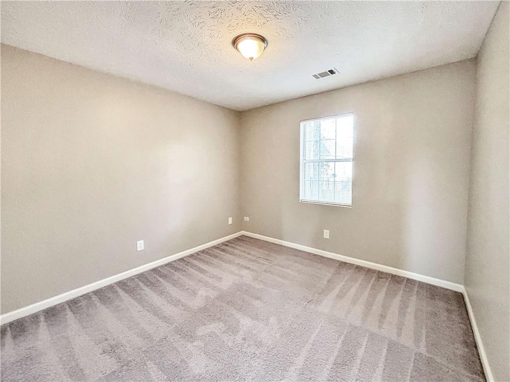 5907 Brookside Drive Southeast Mableton, GA 30126 - Photo 24 of 35 an empty room with windows and closet