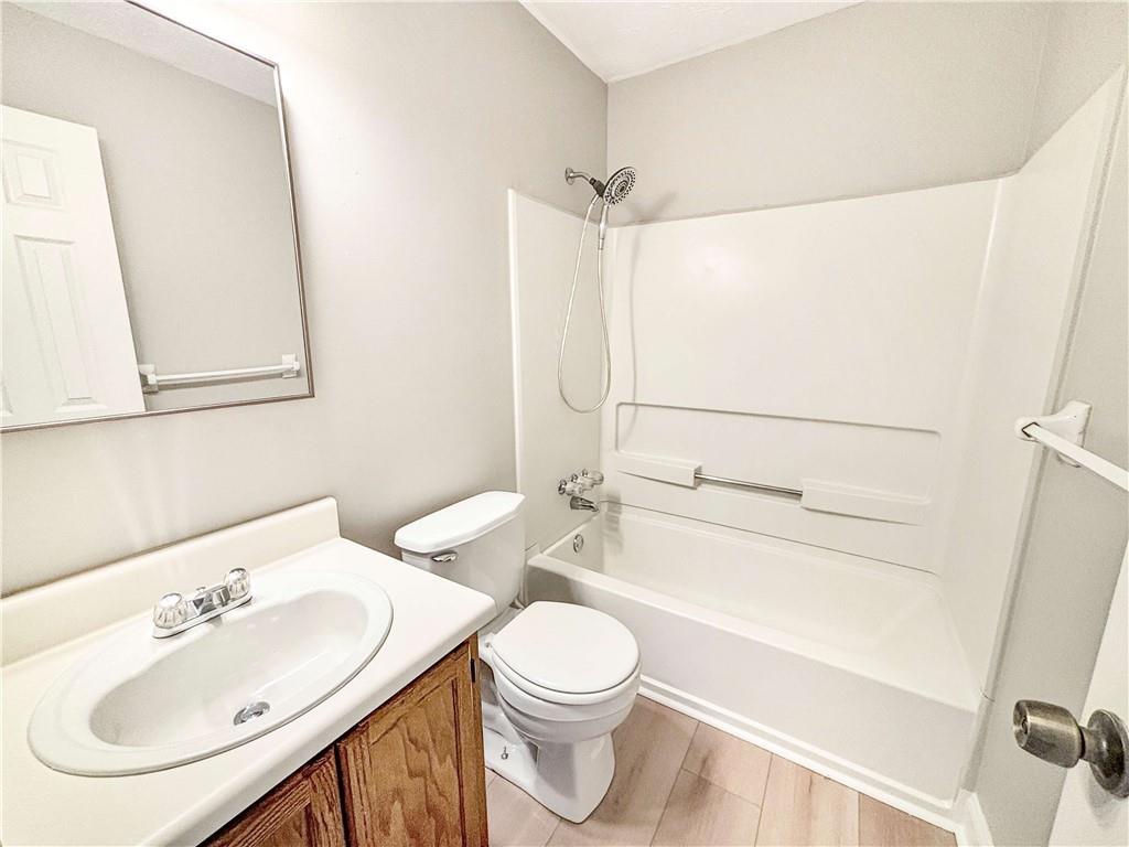 5907 Brookside Drive Southeast Mableton, GA 30126 - Photo 28 of 35 a bathroom with a sink a toilet and shower