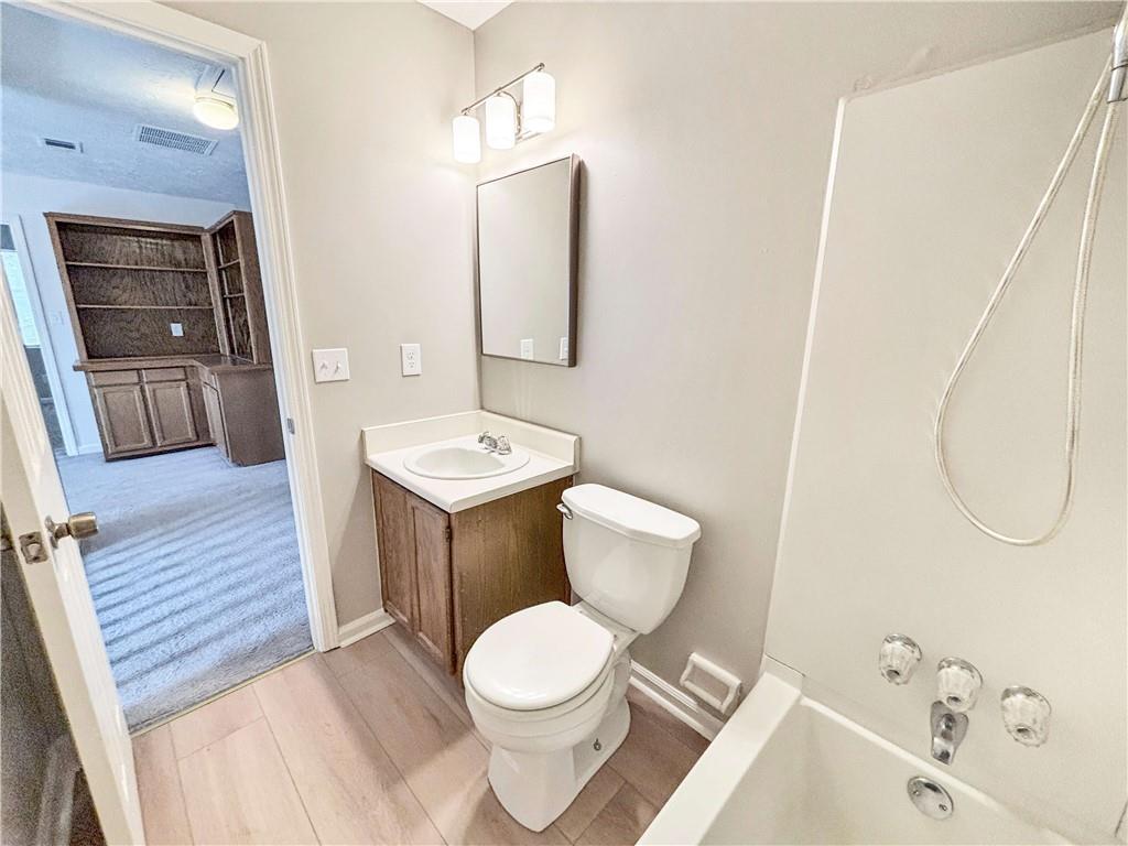 5907 Brookside Drive Southeast Mableton, GA 30126 - Photo 29 of 35 a bathroom with a sink a toilet and shower