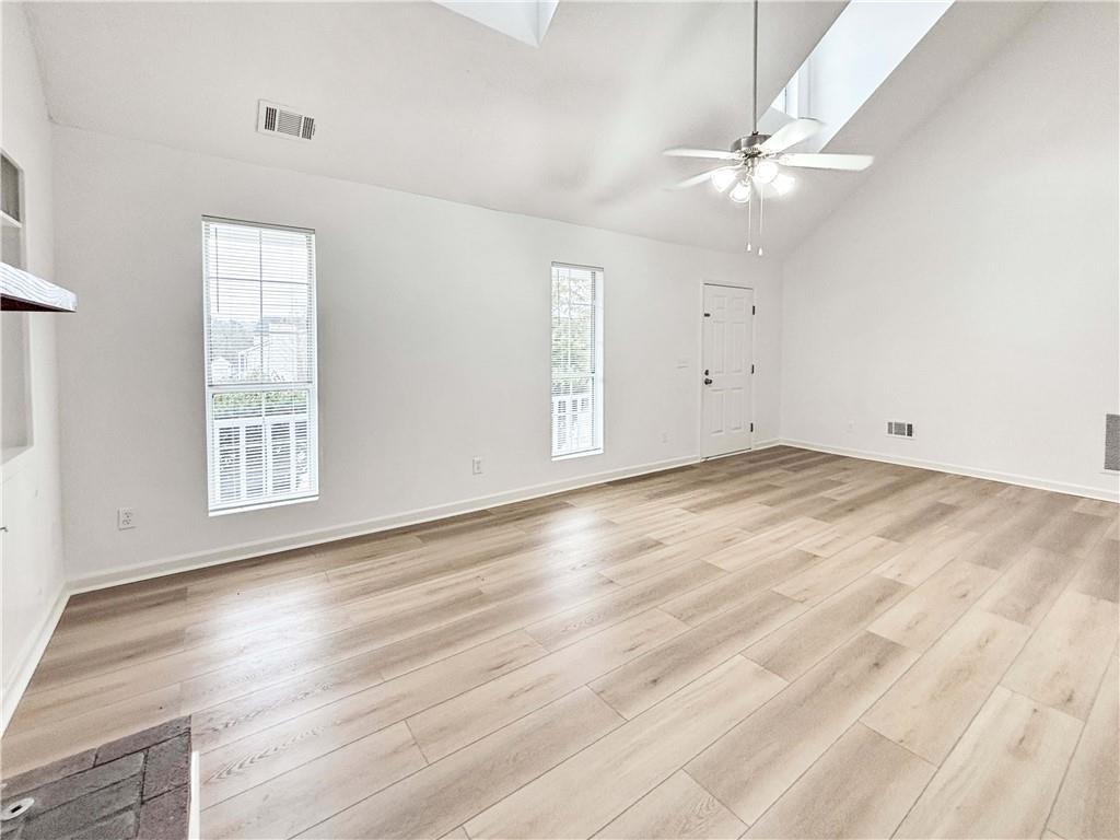 5907 Brookside Drive Southeast Mableton, GA 30126 - Photo 7 of 35 wooden floor in an empty room with a window