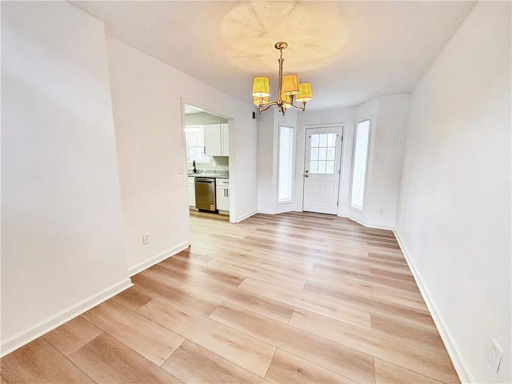 5907 Brookside Drive Southeast Mableton, GA 30126 - Photo 8 of 35 a view of a livingroom with a chandelier