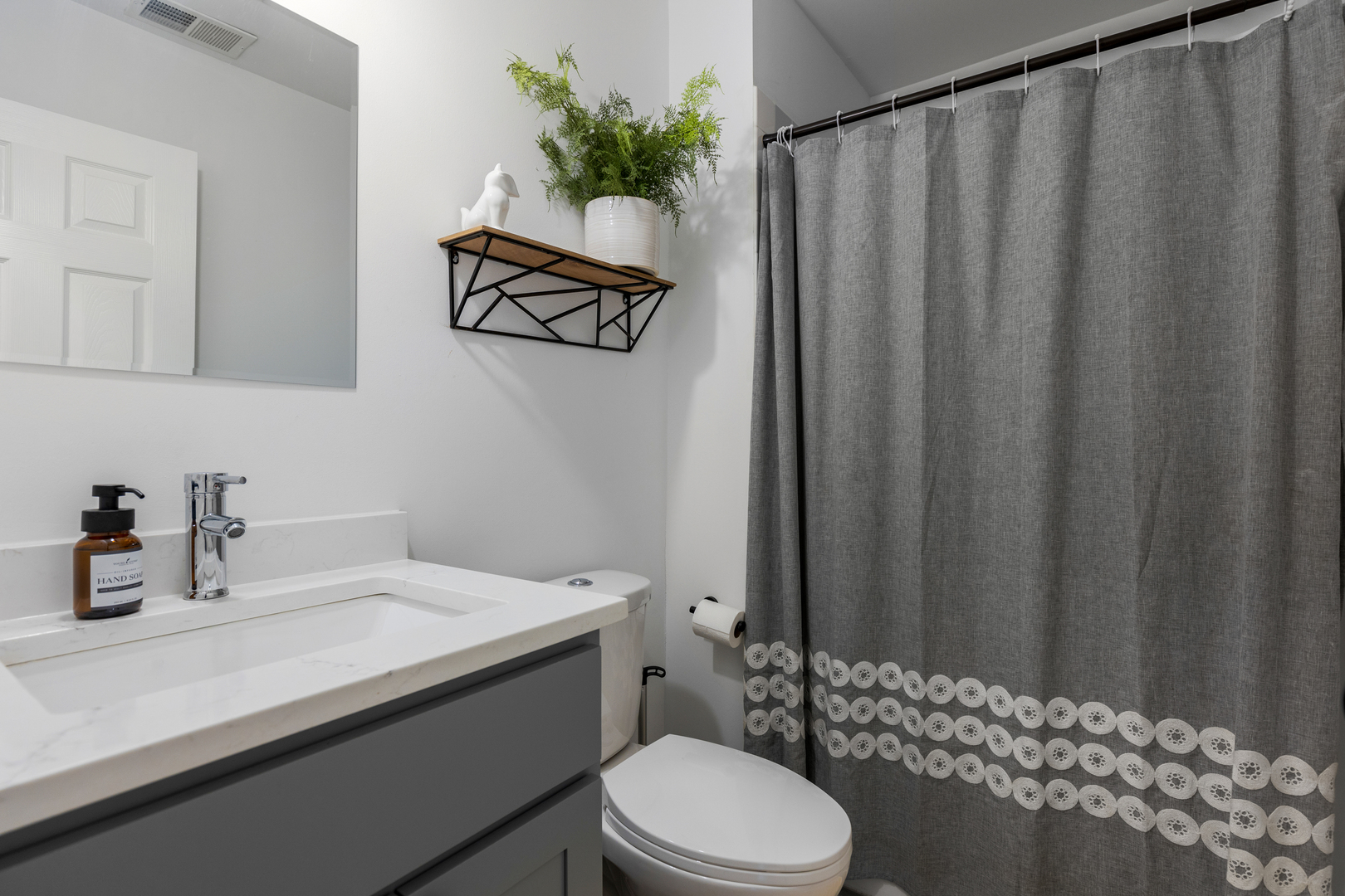 77 Pine Circle Cary, IL 60013 - Photo 12 of 13 a bathroom with a sink a toilet and shower curtain