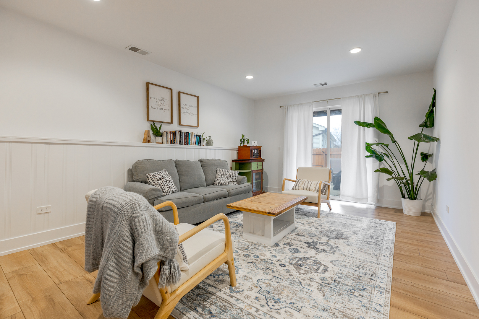 77 Pine Circle Cary, IL 60013 - Photo 10 of 13 a living room with furniture and a wooden floor