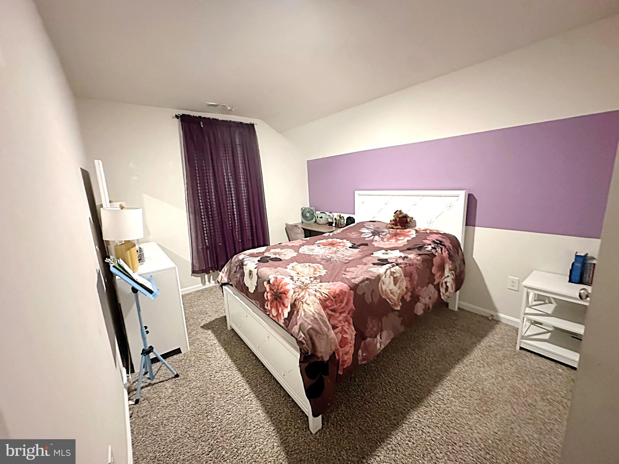 490 Mossy Grove Lane La Plata, MD 20646 - Photo 14 of 20 a bed sitting in a bedroom next to a window