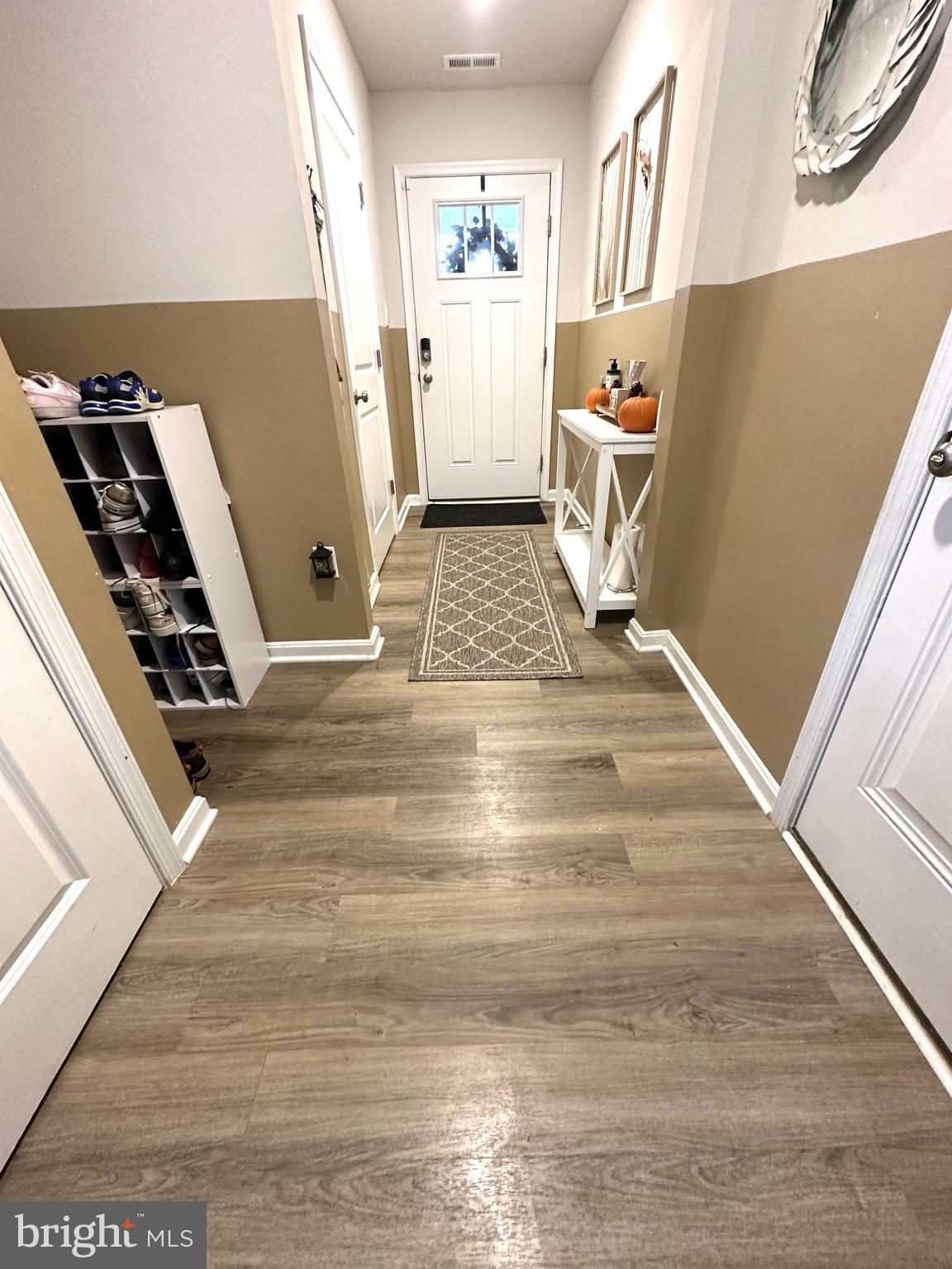 490 Mossy Grove Lane La Plata, MD 20646 - Photo 2 of 20 a view of an empty room with wooden floor and stairs
