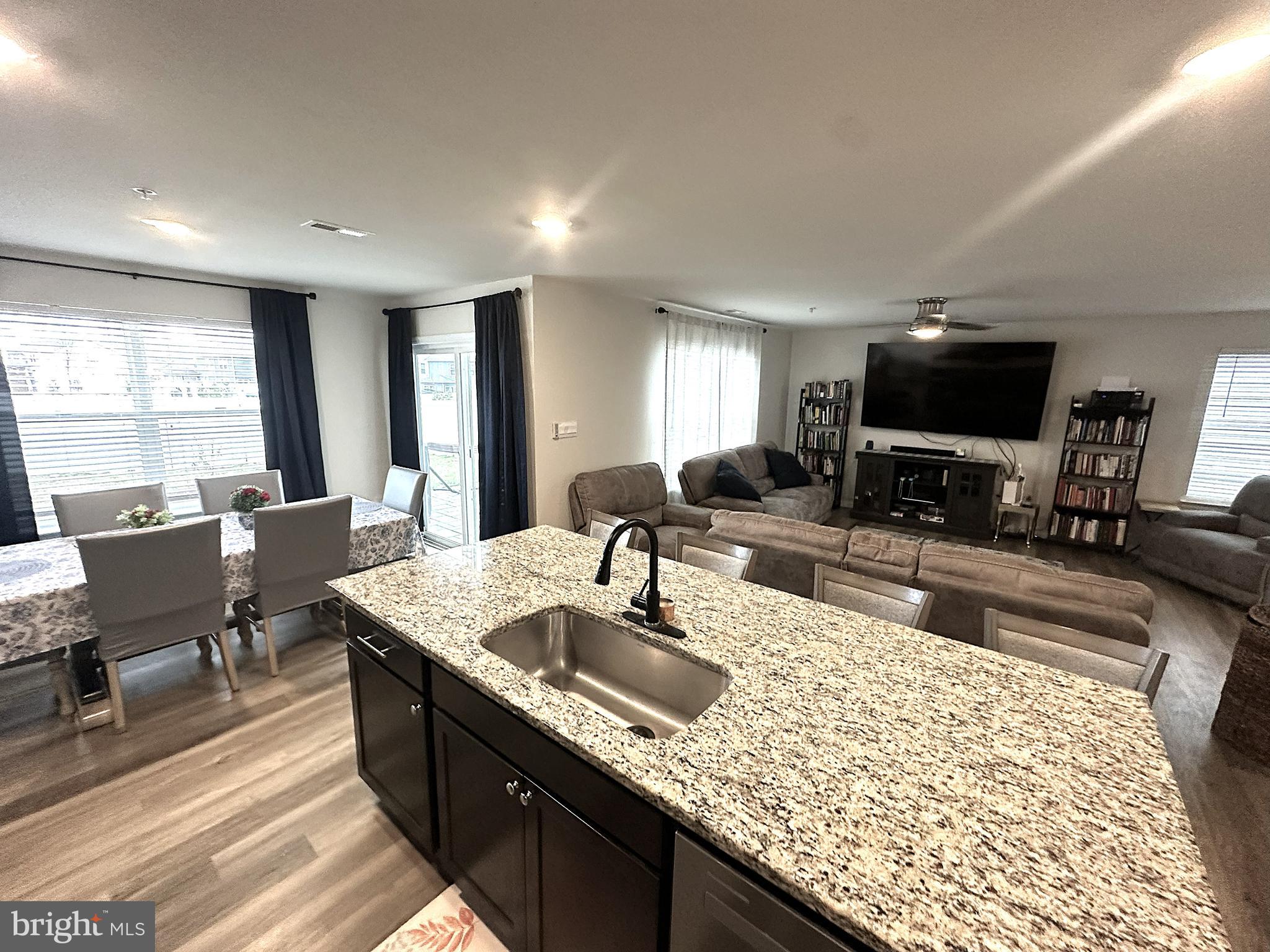 490 Mossy Grove Lane La Plata, MD 20646 - Photo 7 of 20 a kitchen with granite countertop a sink and a counter top space