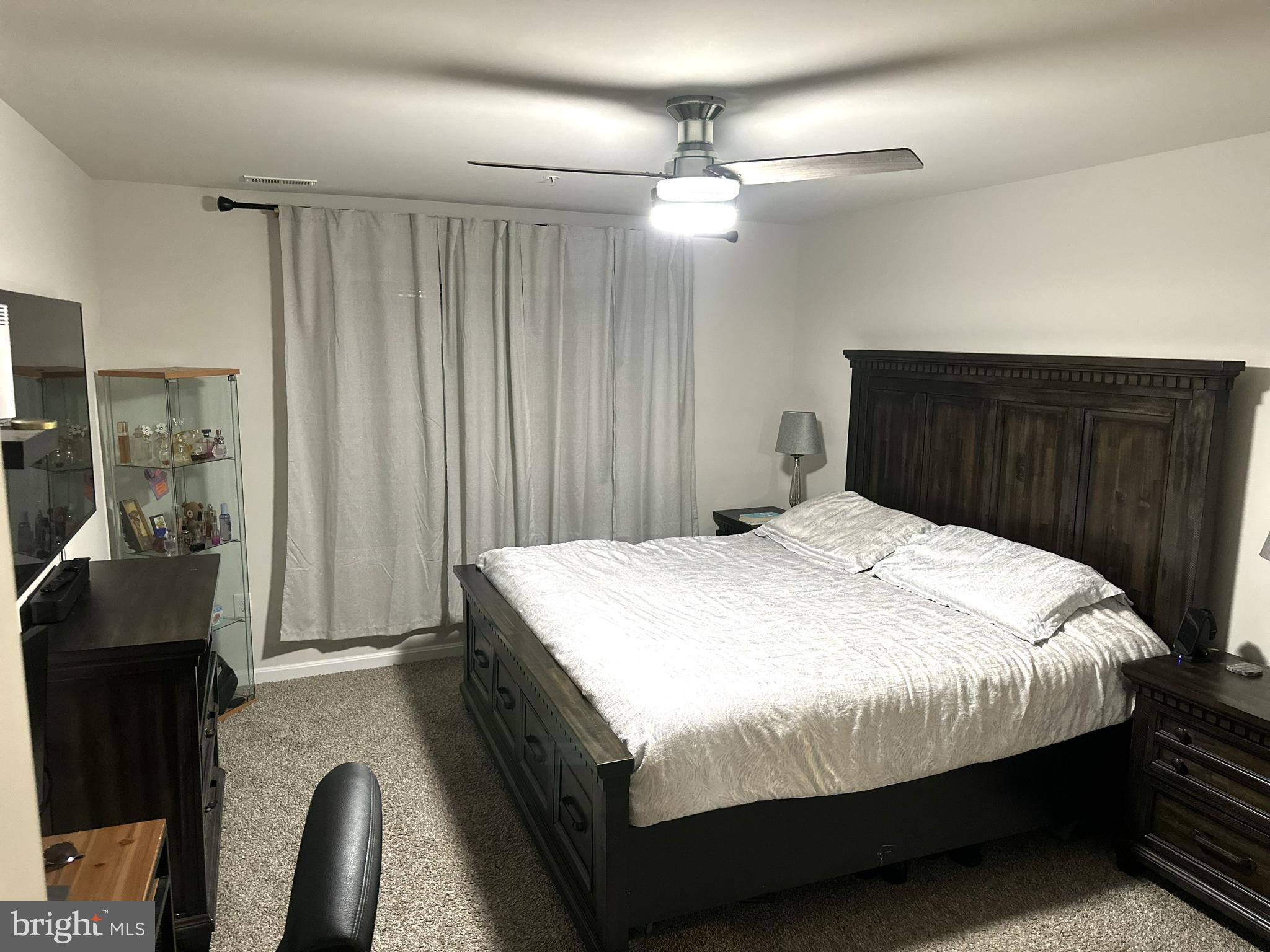 490 Mossy Grove Lane La Plata, MD 20646 - Photo 9 of 20 a bedroom with a bed and a mirror