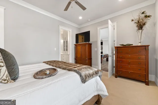 an aerial view of a house with a garden and lake view