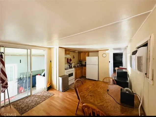 a bedroom with furniture and a wooden floor