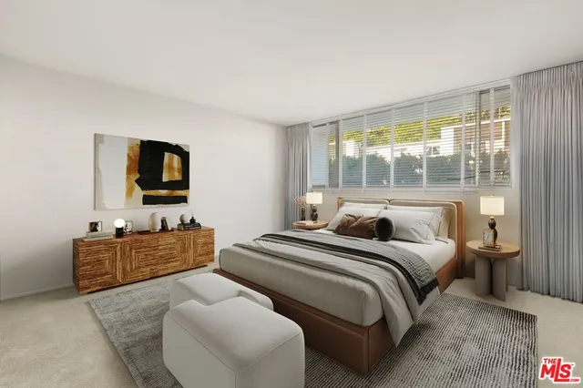 a bedroom with a bed and glass window