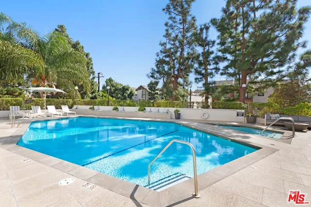 a view of a swimming pool with a patio