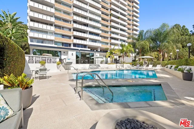 a view of a swimming pool with a patio