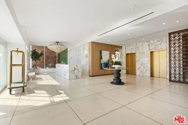 a front view of a building with a yard