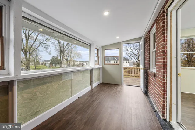 a view of a room with a large window