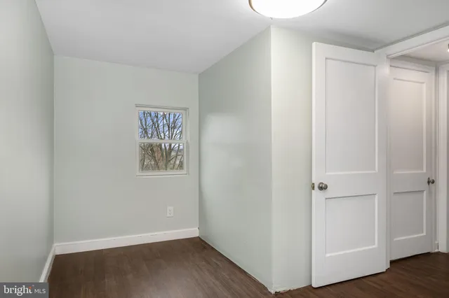 a view of hallway with wooden floor