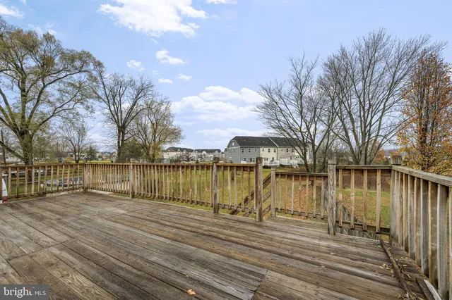 a lake view with wooden bridge