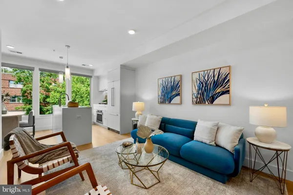 a living room with furniture and a large window