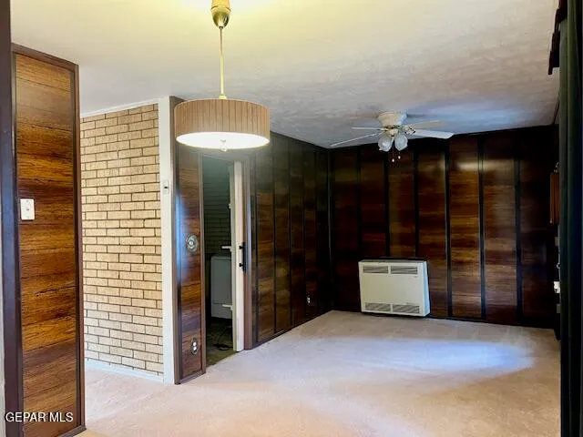 a view of a room with furniture and a window
