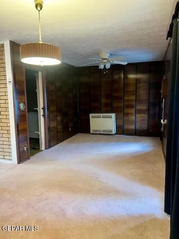 a room with a large window and a table