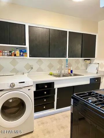 a bathroom with a shower curtain and a toilet