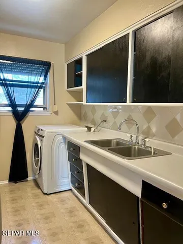 a bathroom with a sink a mirror and a vanity