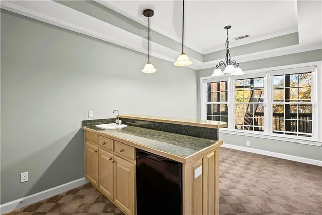 a view of a house with snow on the yard