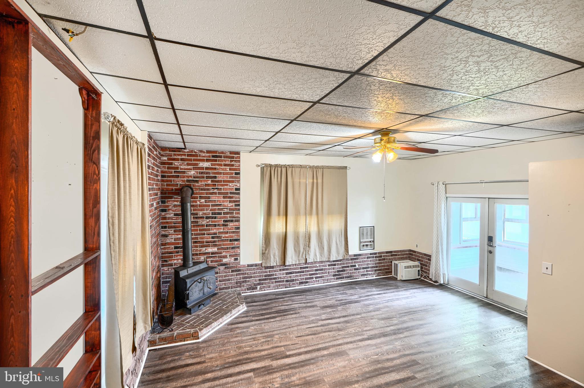 2215 Lodge Farm Road Baltimore, MD 21219 - Photo 18 of 38 Family room with wood stove (ground level)