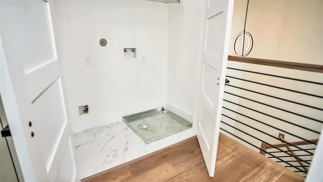 a view of front door with wooden floor