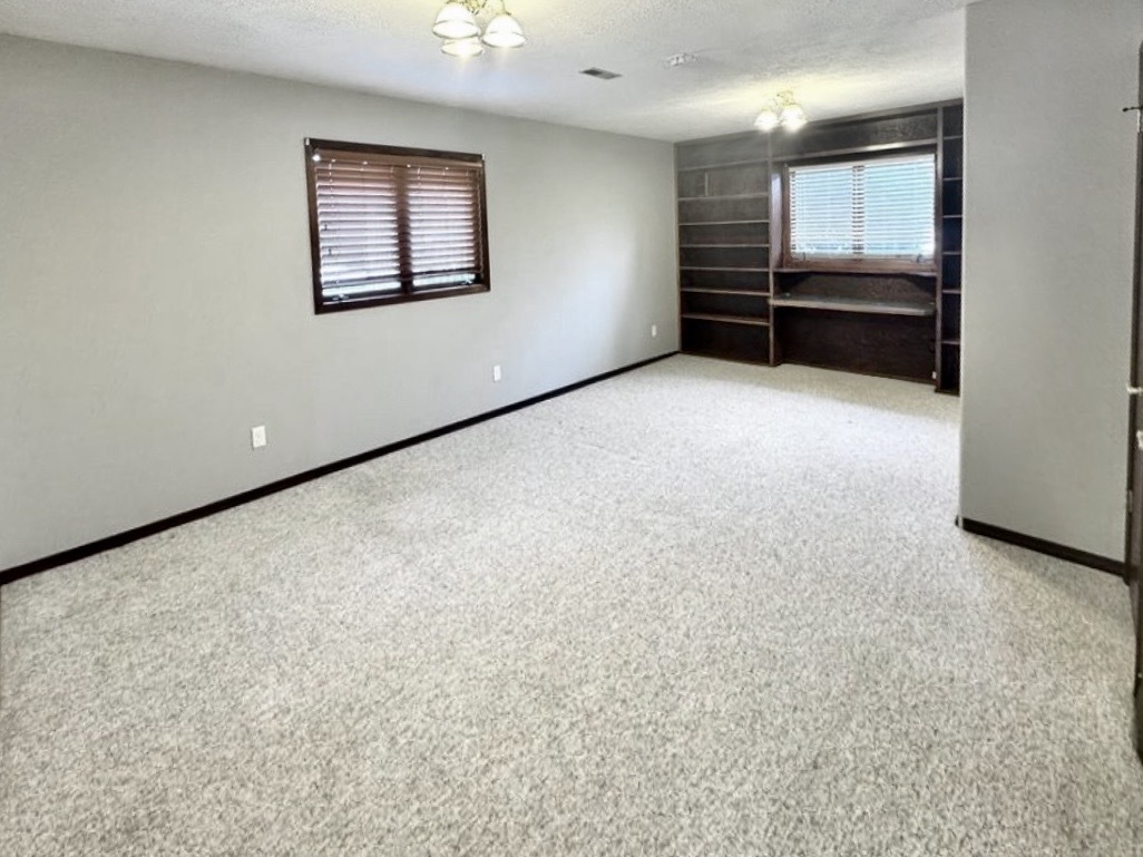 117 Colchester Drive Normal, IL 61761 - Photo 19 of 32 an empty room with windows